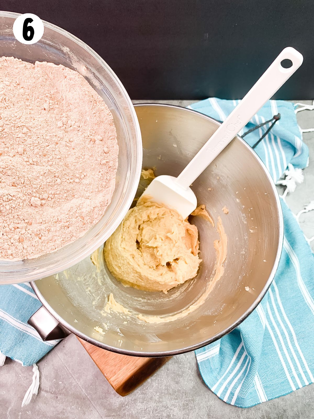 dry ingredients in bowl over sugar, butter mixture in large mixing bowl.