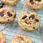 cookies on cooling rack that are made with crushed Oreo cookies, peppermint baking chips and chocolate chips.