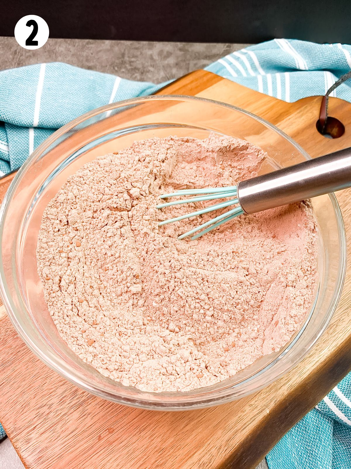 flour, cocoa powder mixture in bowl with wire whisk.