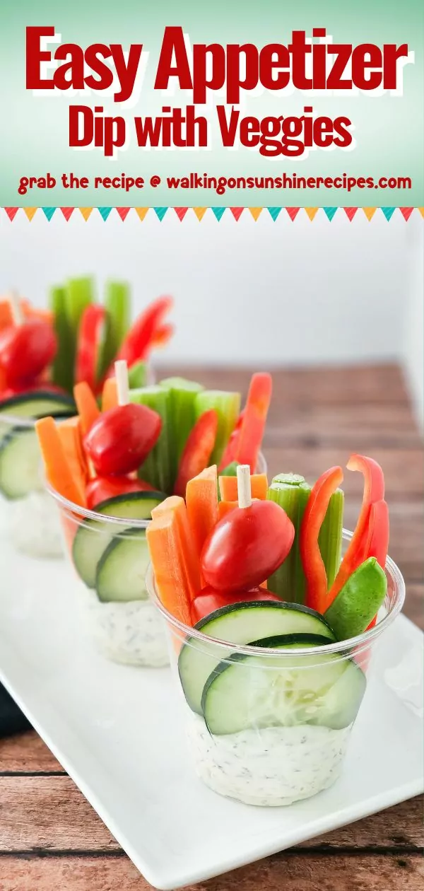 Creamy dip served in individual plastic cups with fresh veggies.