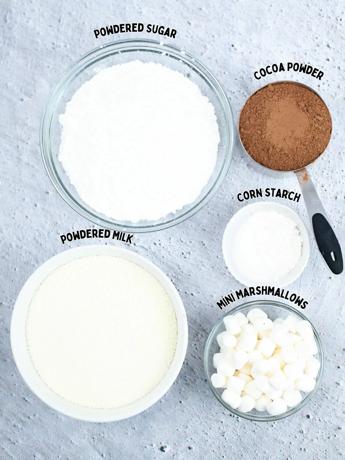 ingredients for homemade hot chocolate in small bowls.