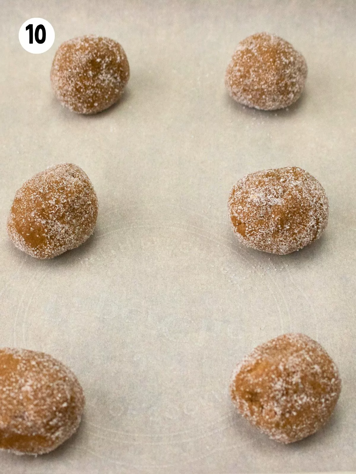 gingersnap cookie dough balls on baking tray.