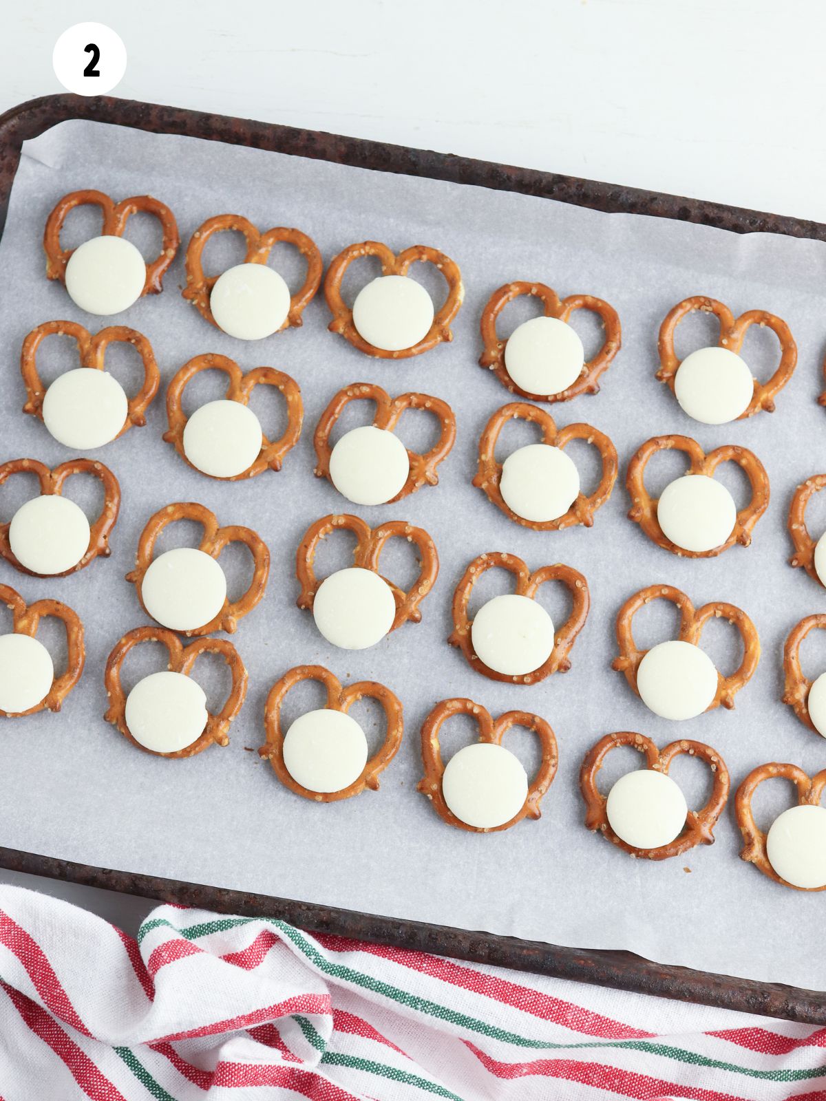 white candy melts on pretzel twists.