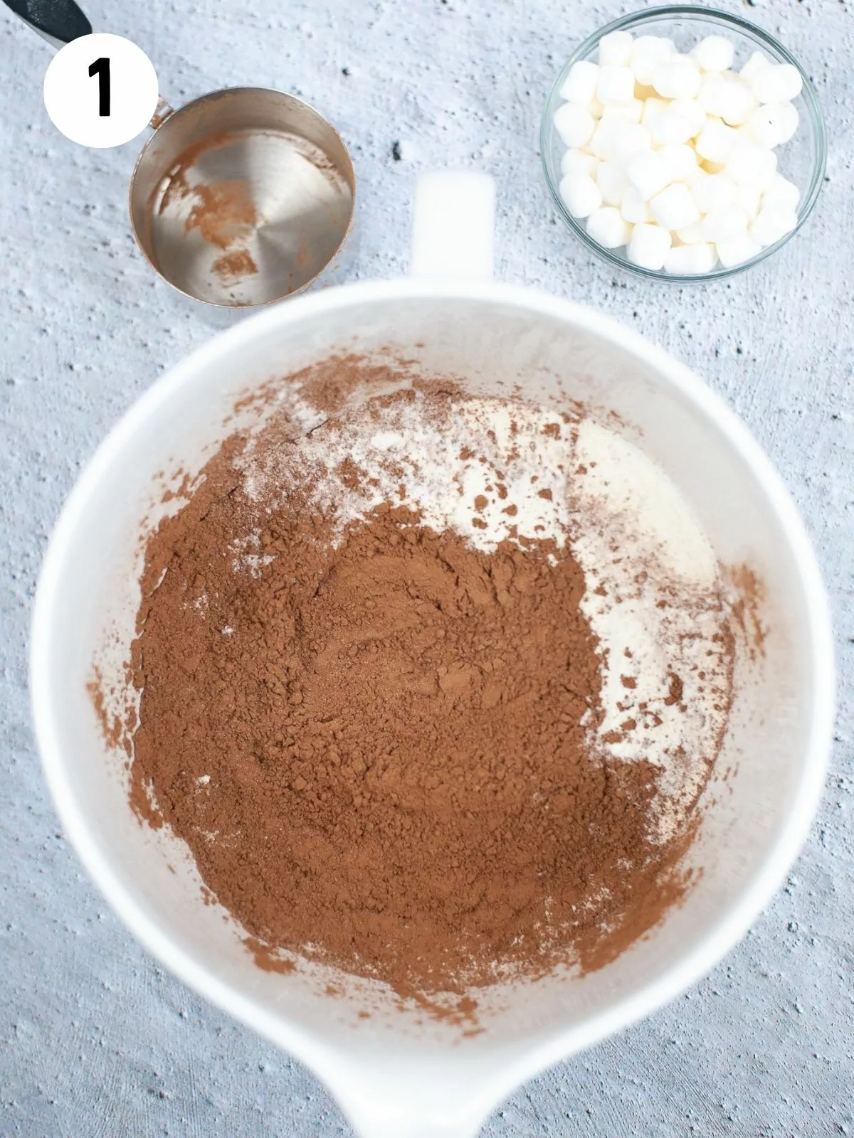 add hot cocoa ingredients together in bowl.