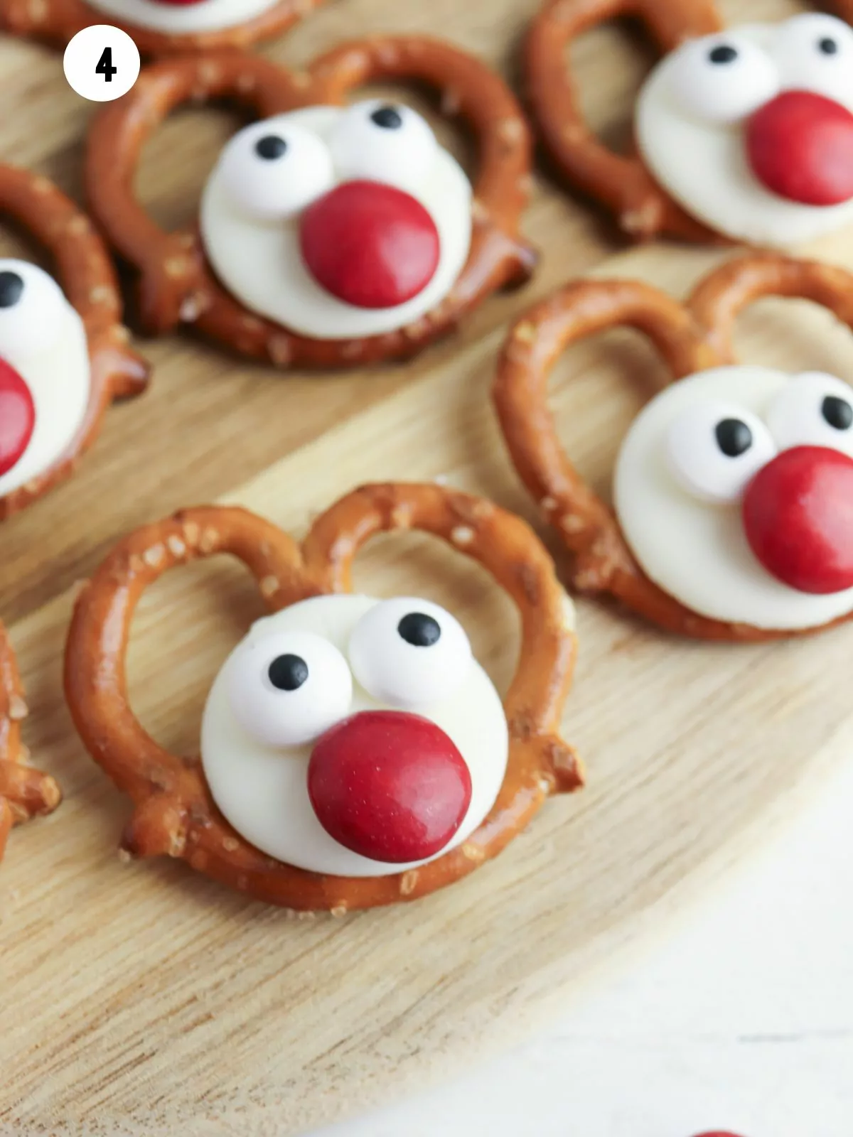 closeup of reindeer pretzel with M&M candy nose.
