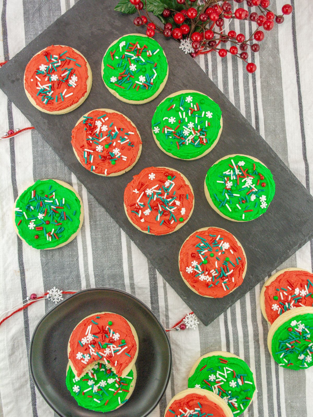 sugar cookies frosted and displayed on gray plates.