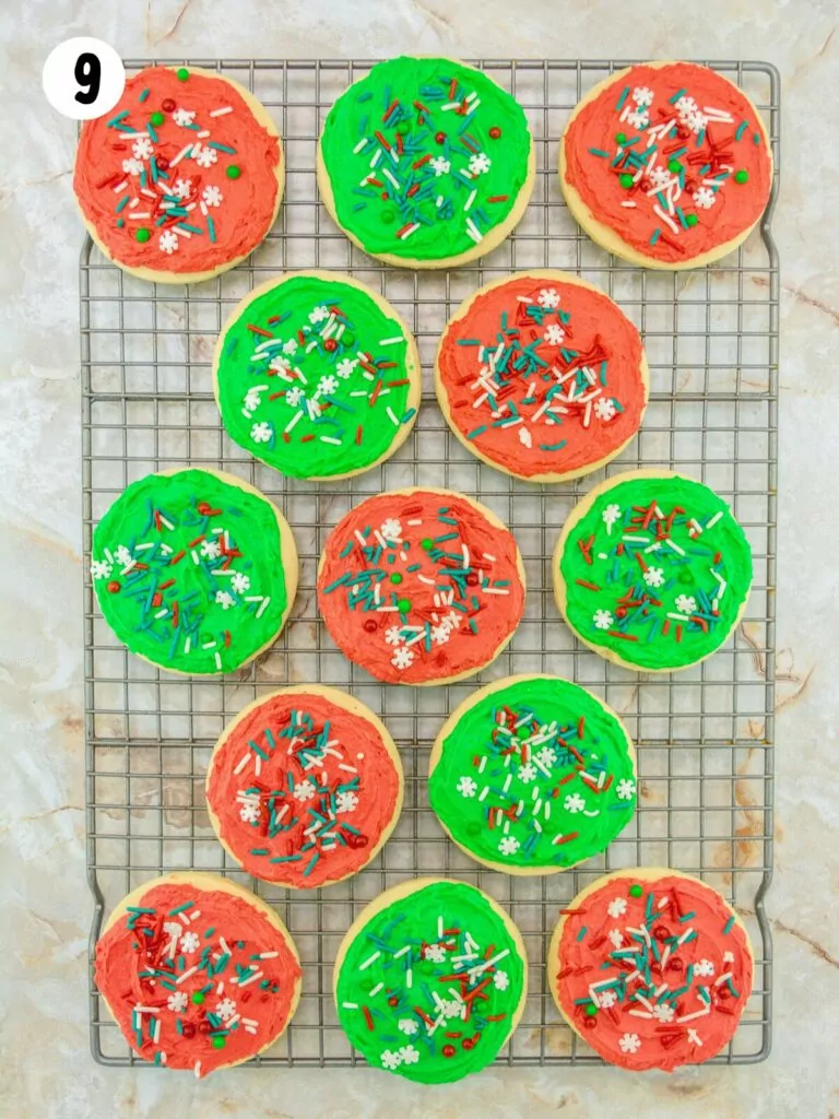 frosted and decorated sugar cookies on cooling rack.