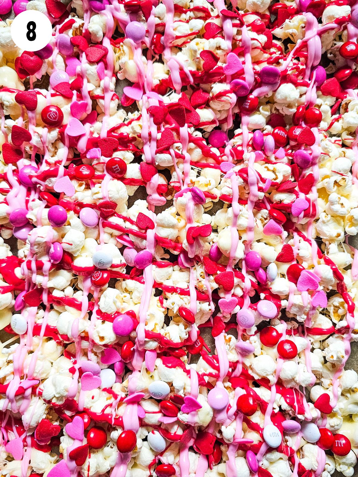 add Valentine's Day heart sprinkles to candy popcorn.