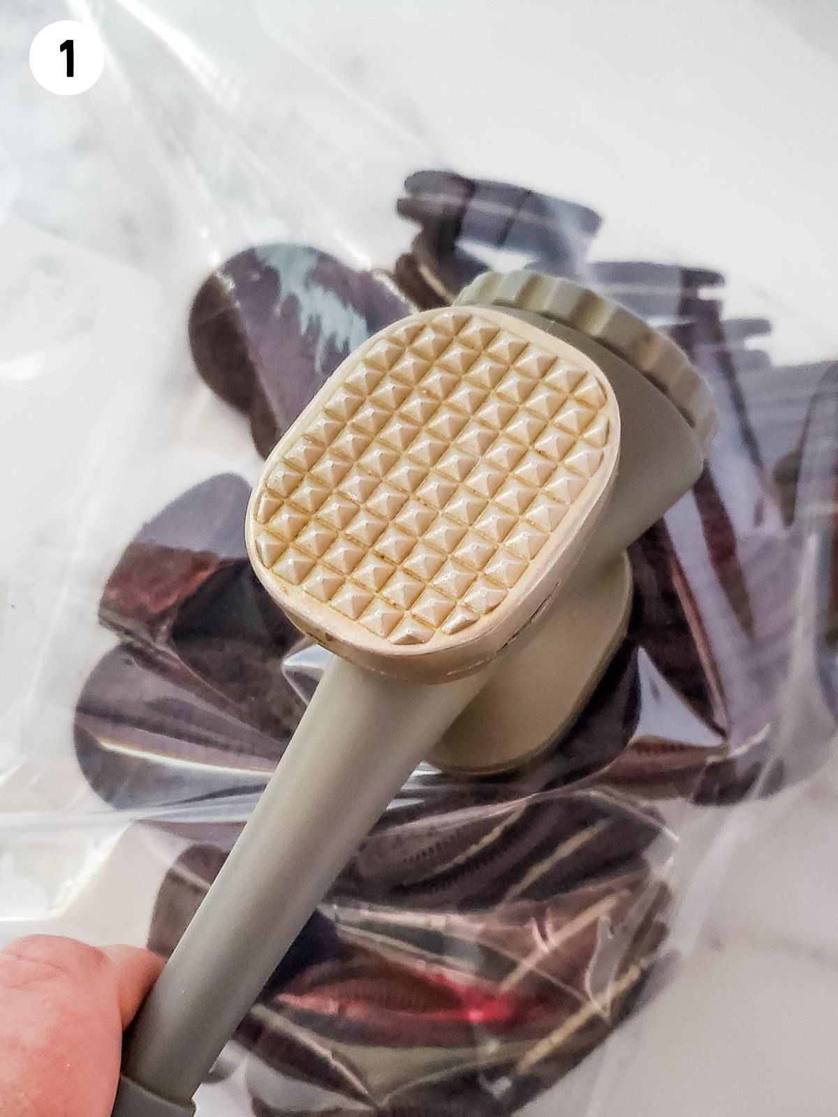 Crush Oreo cookies with meat mallet.