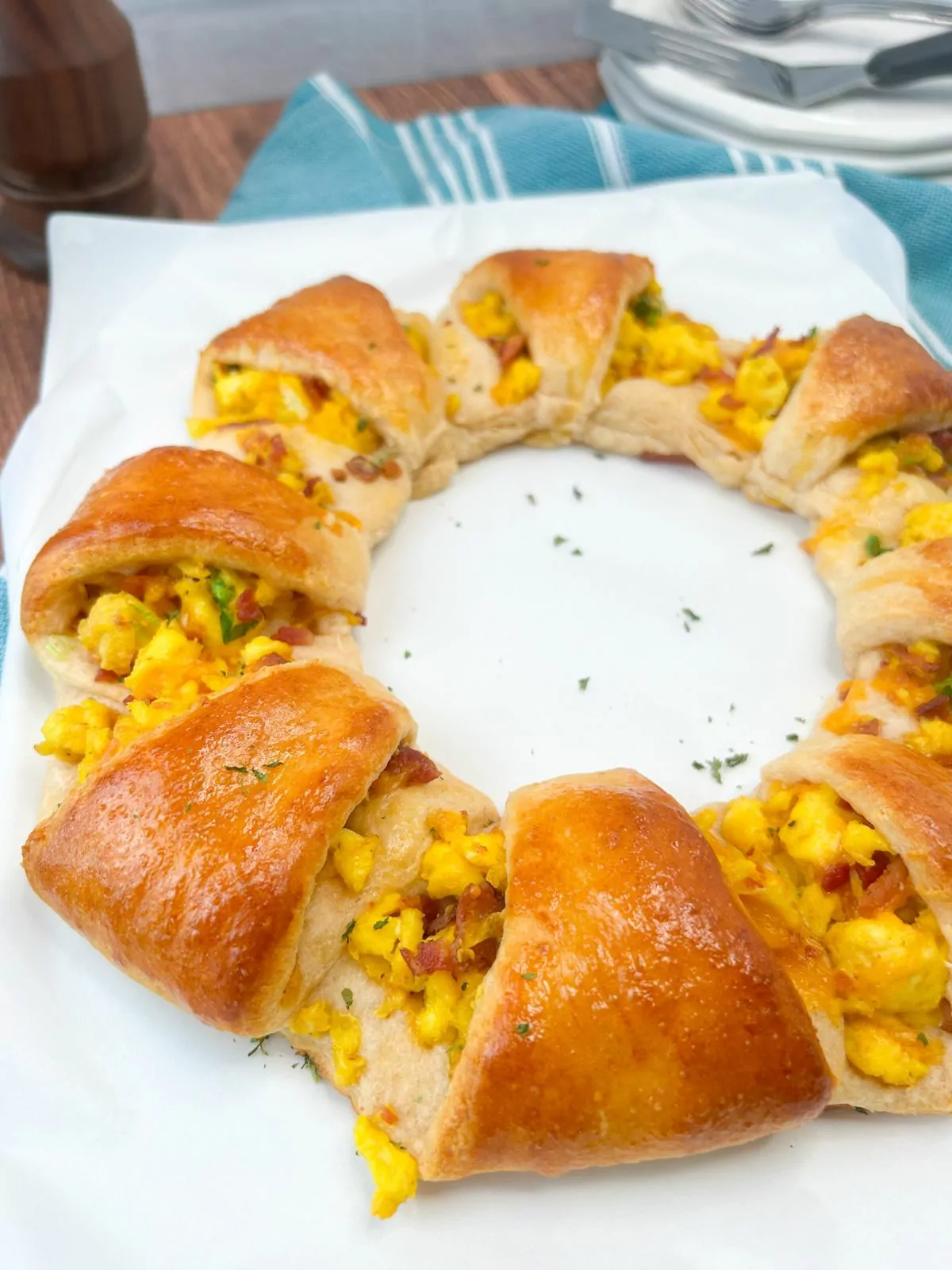 baked crescent roll wreath with eggs and bacon.