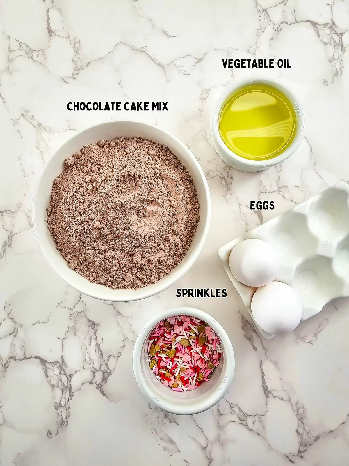 Ingredients for cake mix cookies in small bowls.