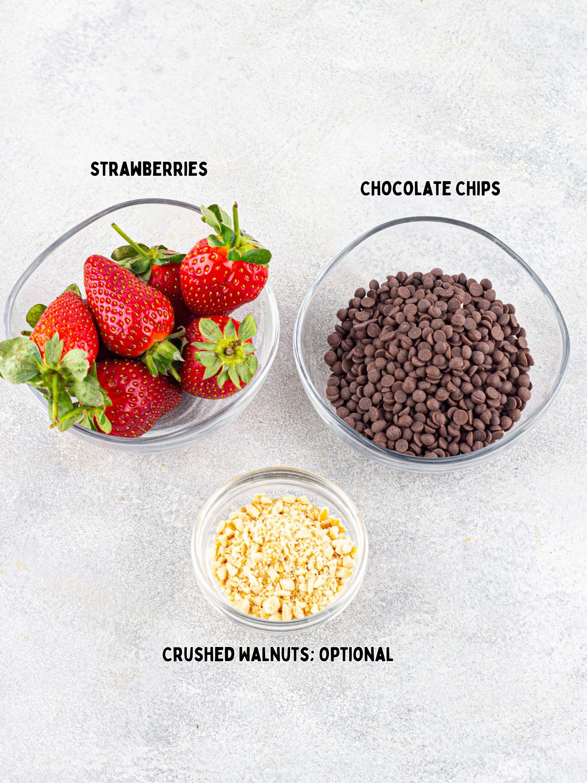 Ingredients for melted chocolate and strawberries.
