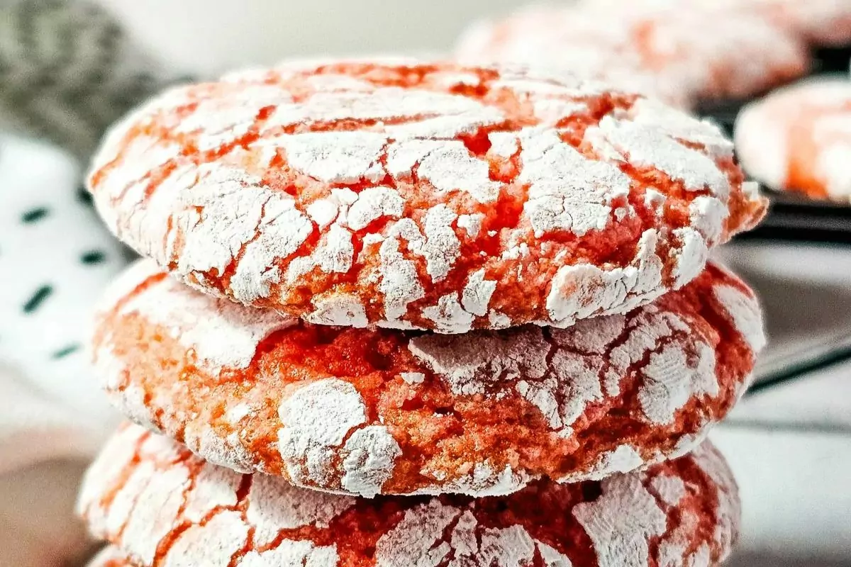 A stack of pink cookies with a crackly texture.