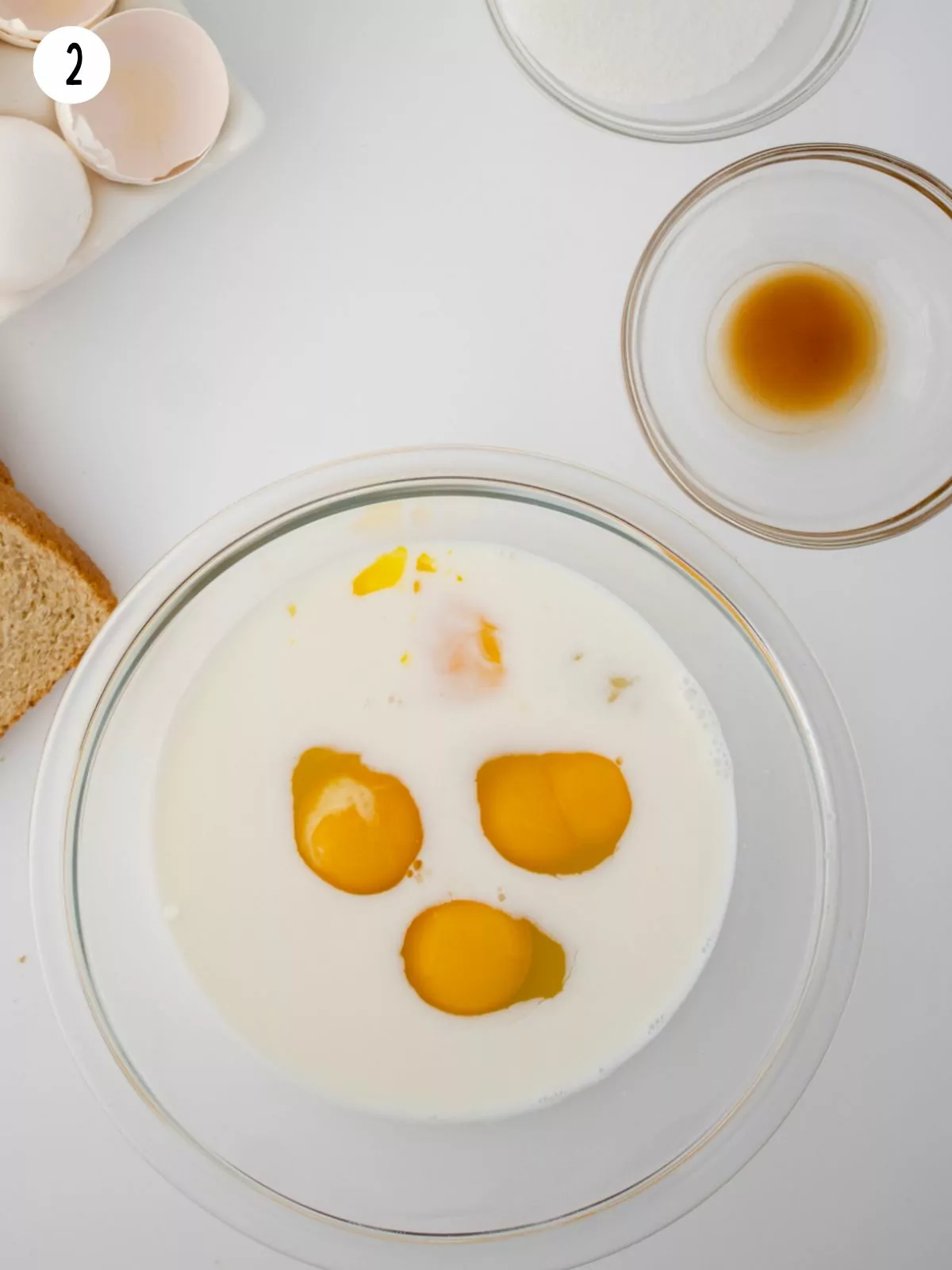 eggs in bowl with milk.