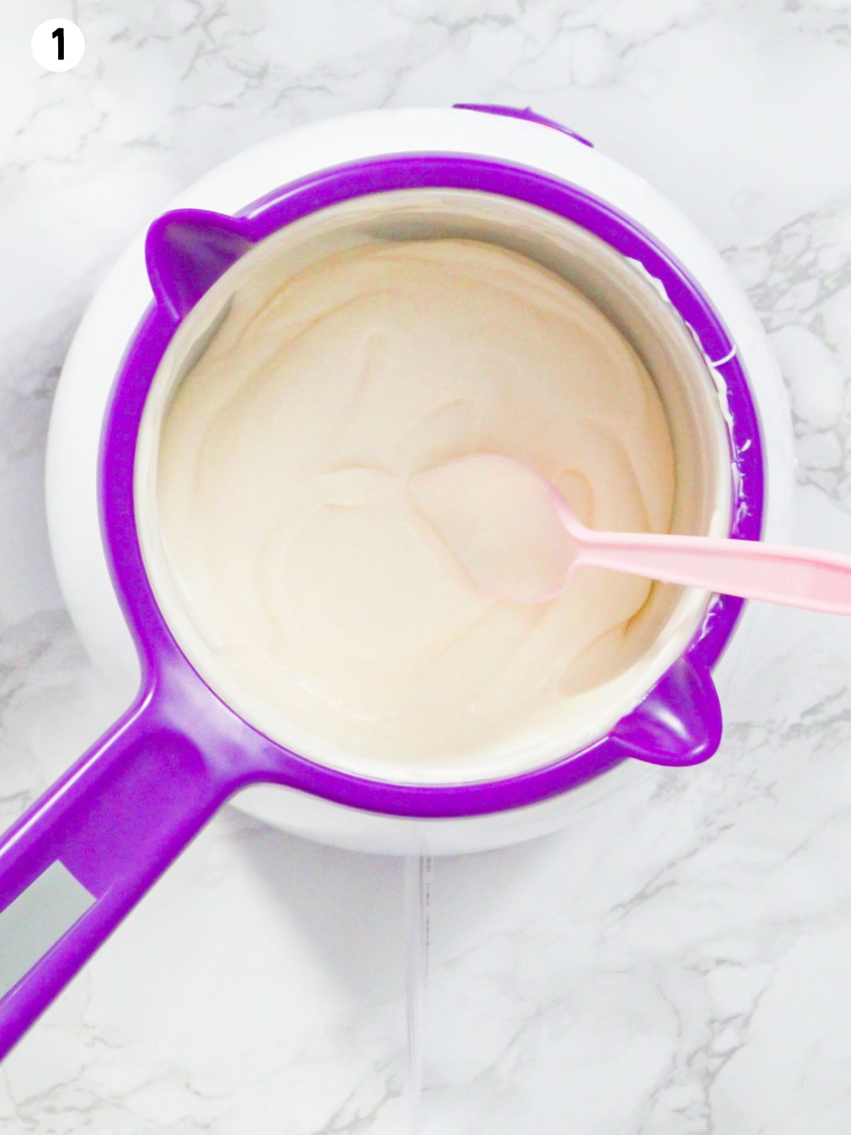 Melted white chocolate in Wilton candy melting pot.