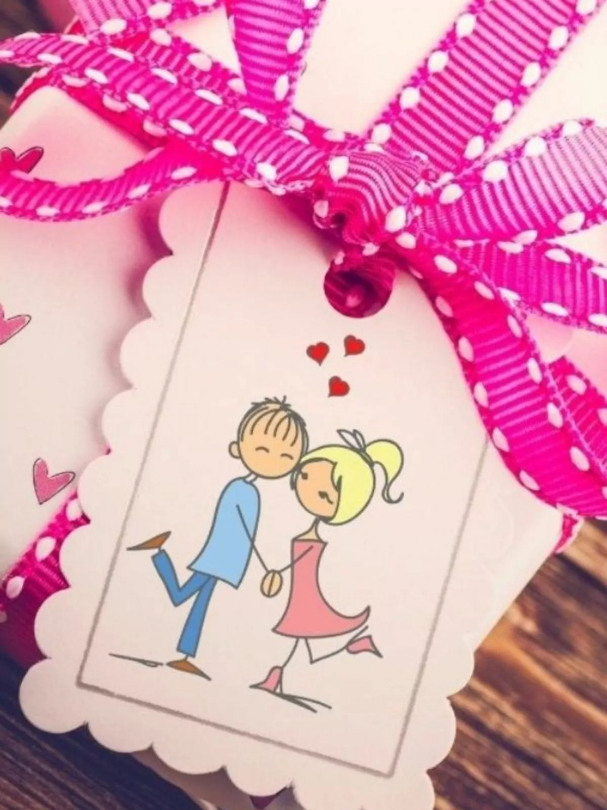 cute couple gift tag with pink polka dot bow.