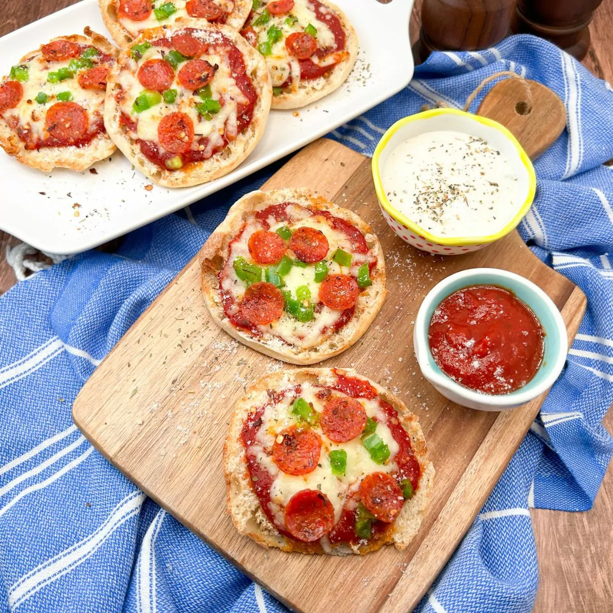 FEATURED Air Fryer English Muffin Pizza on wood cutting board and white platter