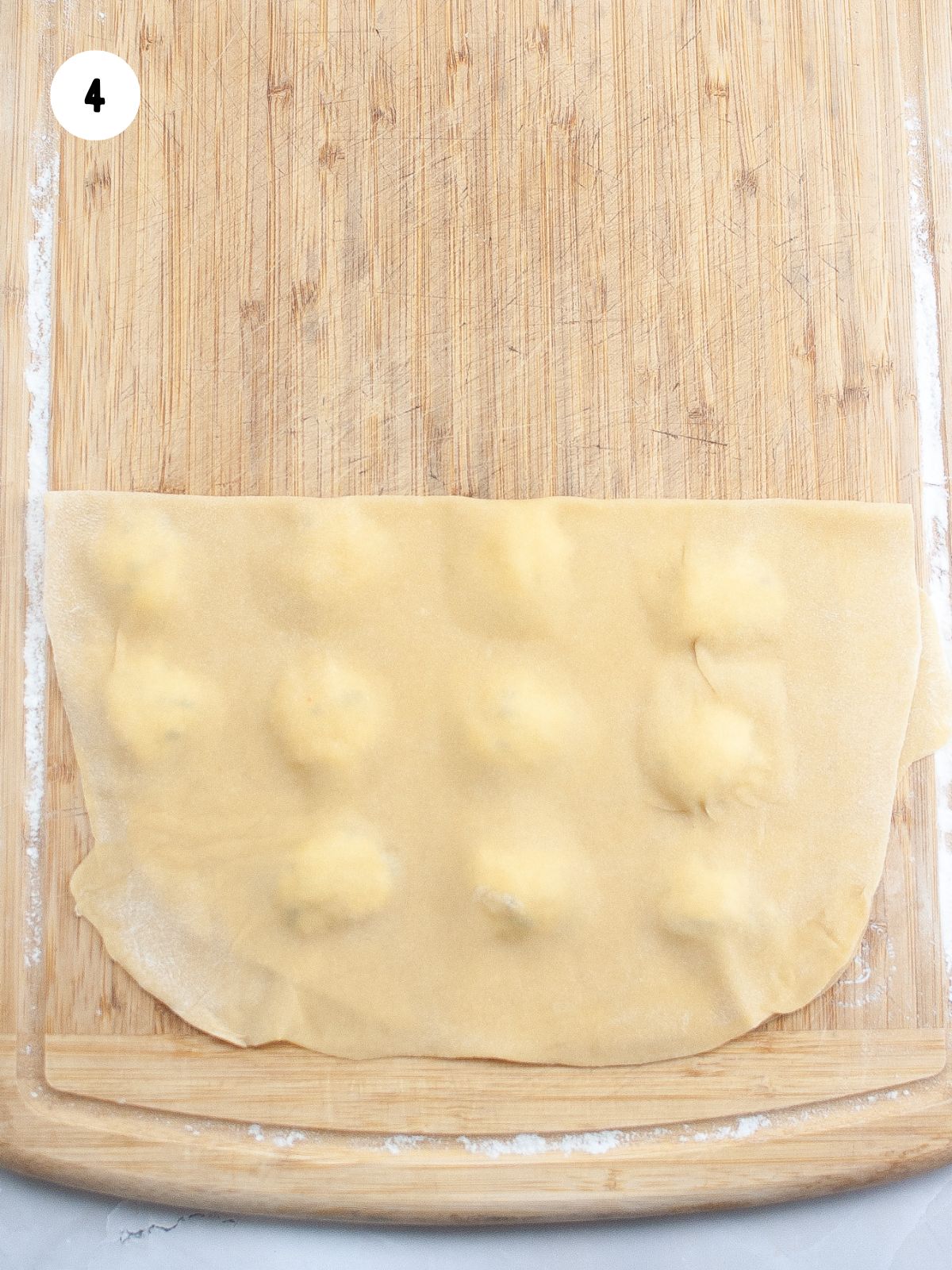 4 - Fold dough over the filling