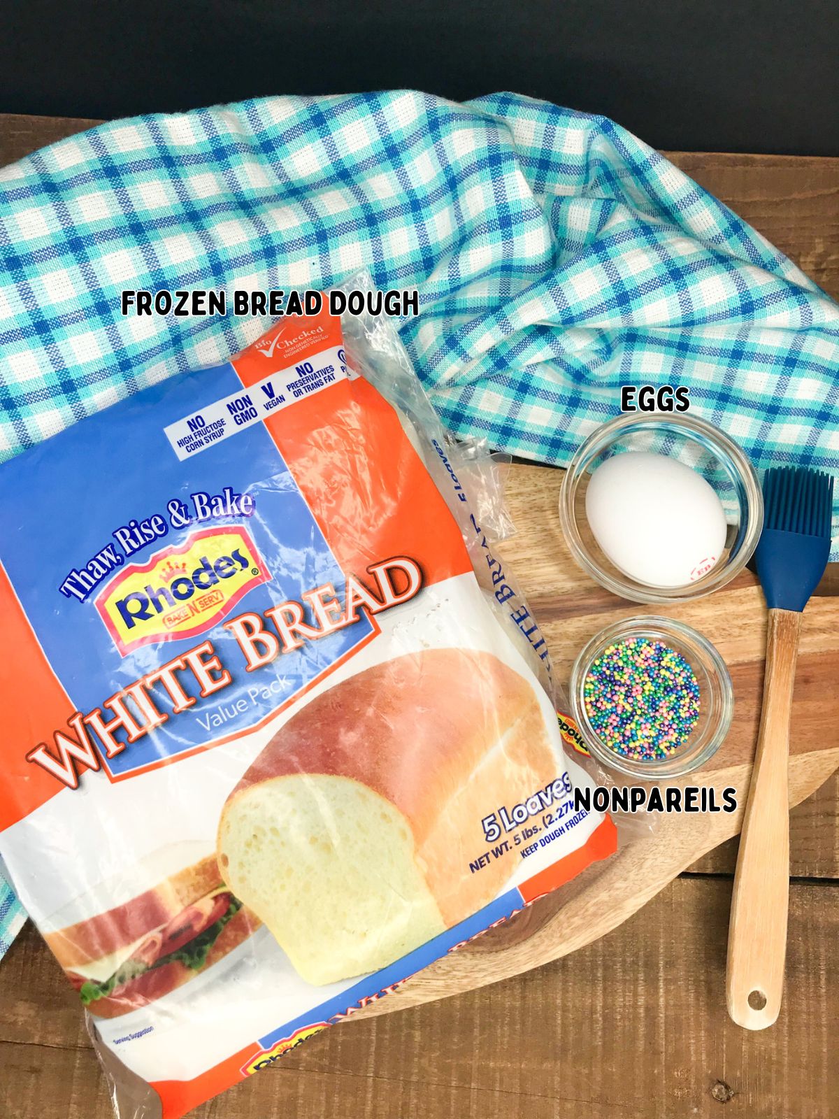 Rhodes frozen bread dough with sprinkles and egg in a bowl.