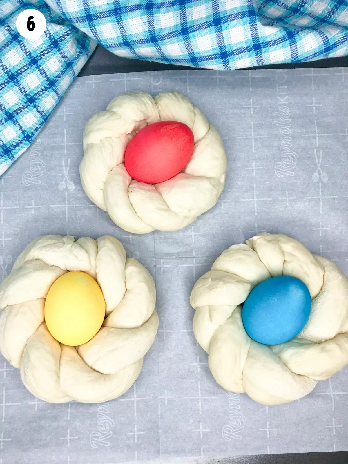 colored Easter eggs in the center of braided dough.