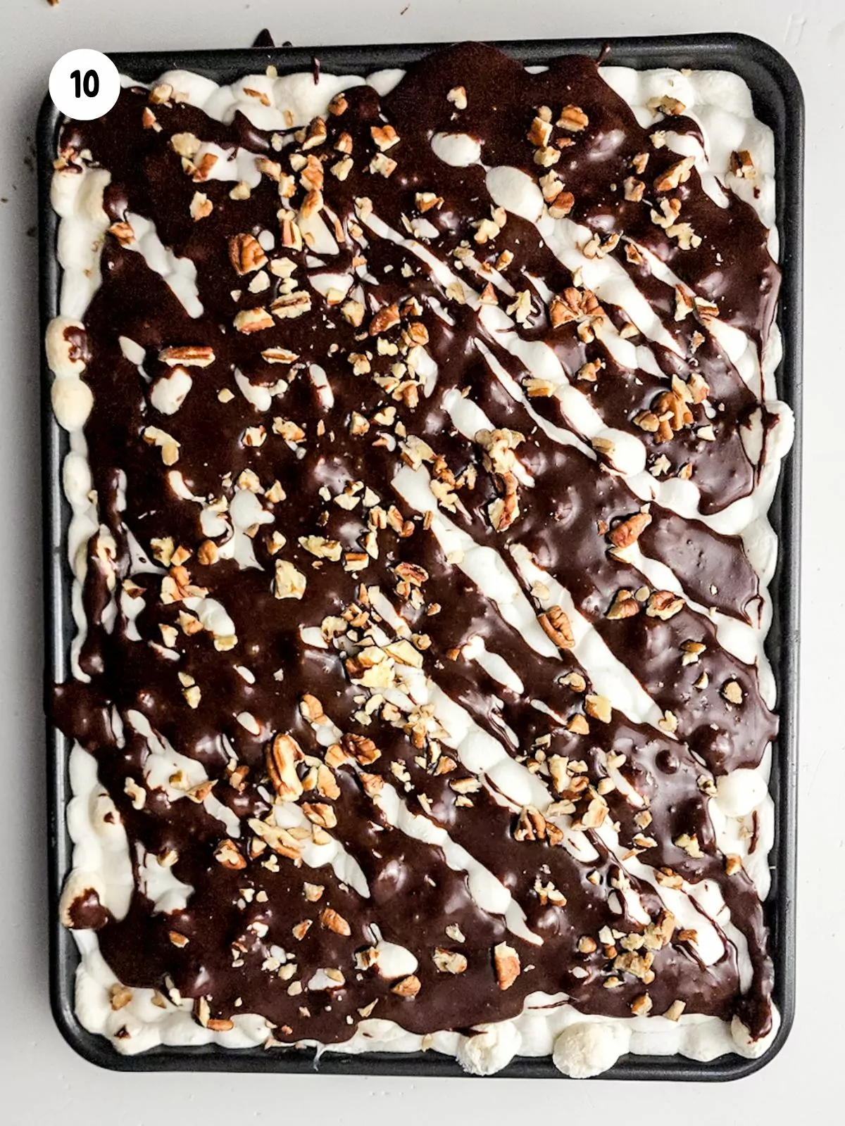 brownies with marshmallows, chocolate syrup and crushed nuts.