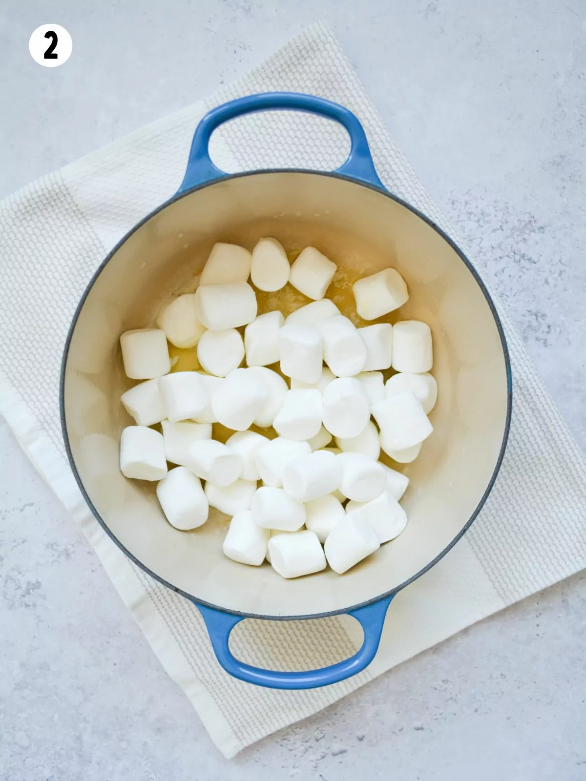 add mini marshmallows to melted butter.