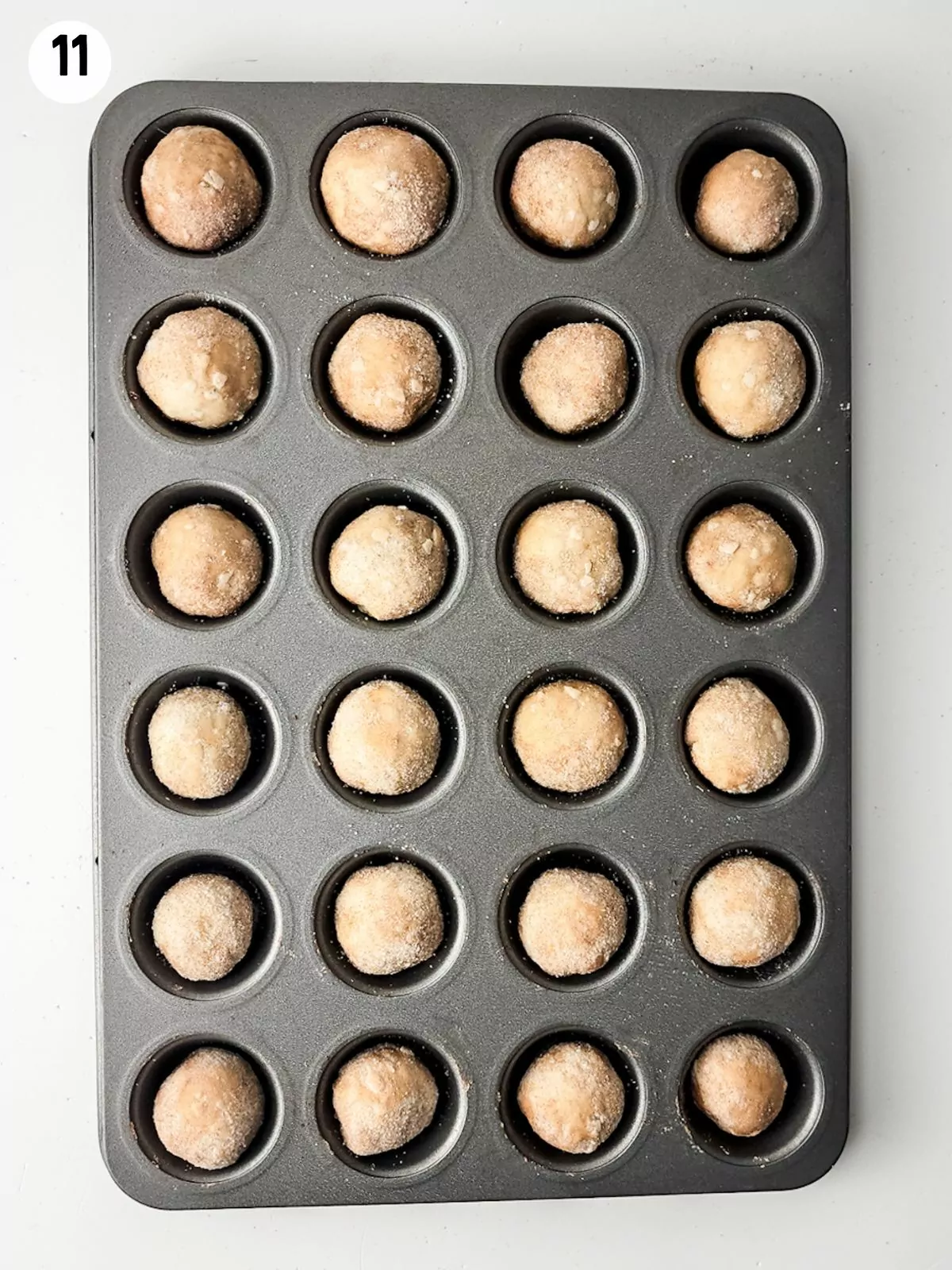 cinnamon roll balls in mini muffin pan.