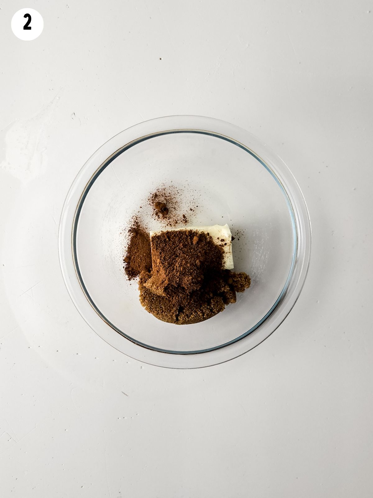 butter, cinnamon, brown sugar in glass bowl.