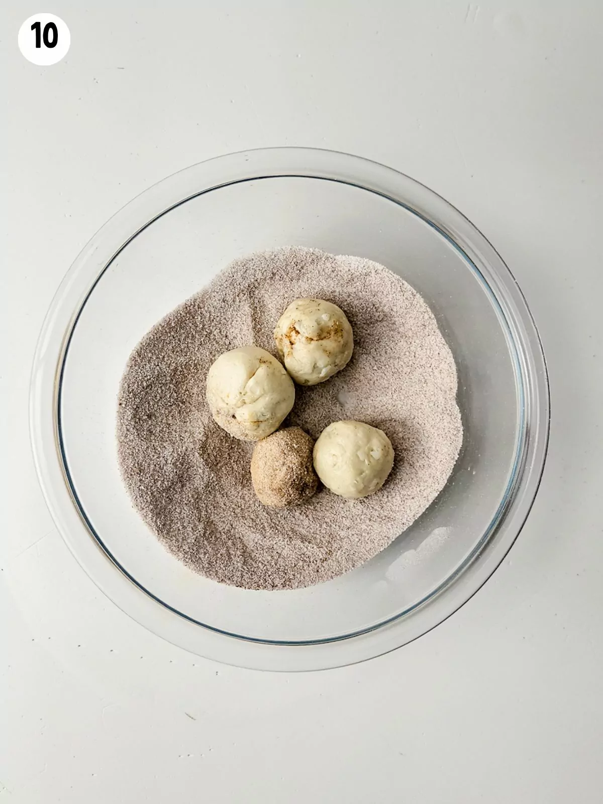 refrigerator biscuit dough rolled into balls in cinnamon sugar mixture.
