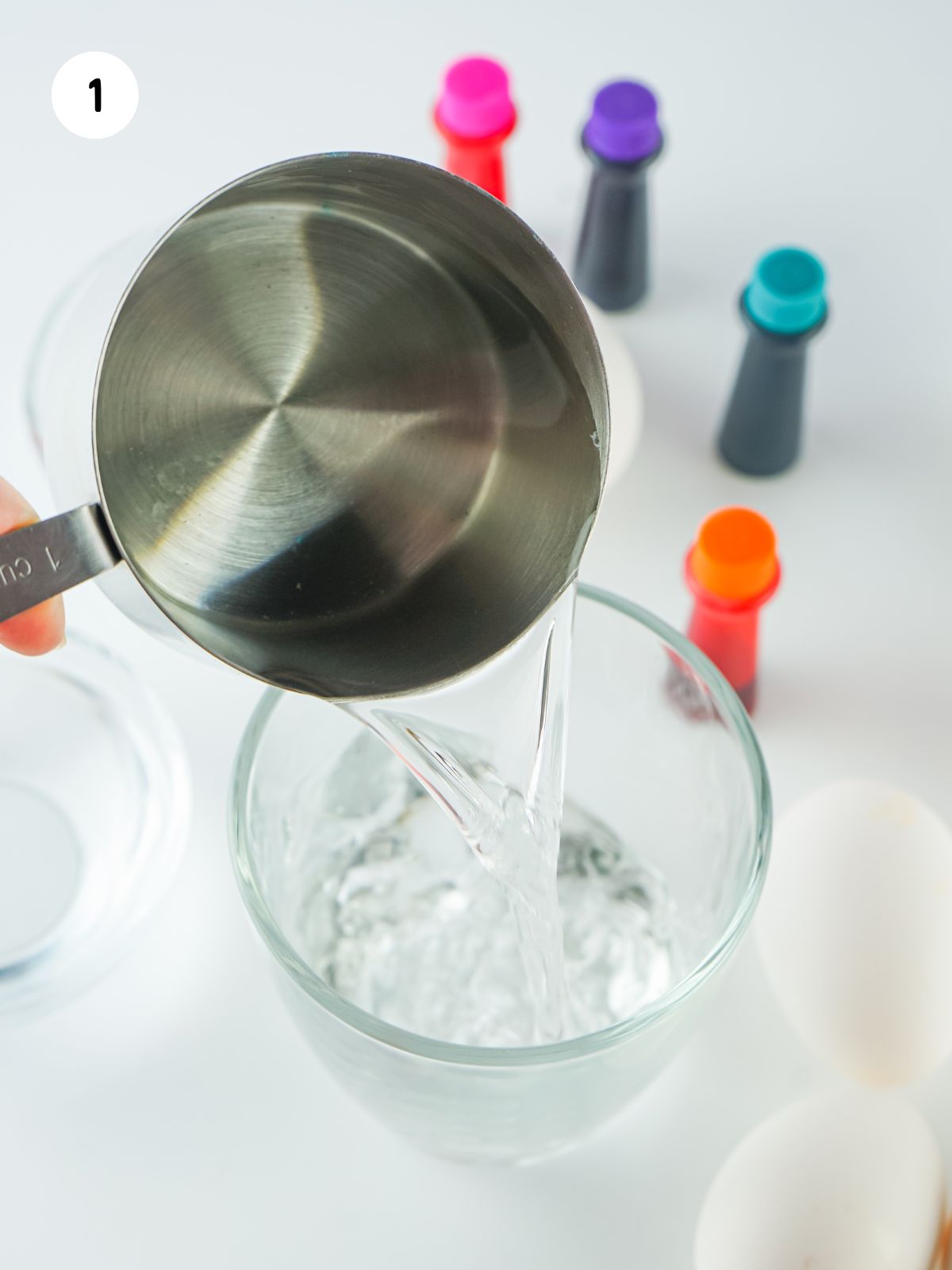 adding water to a glass.