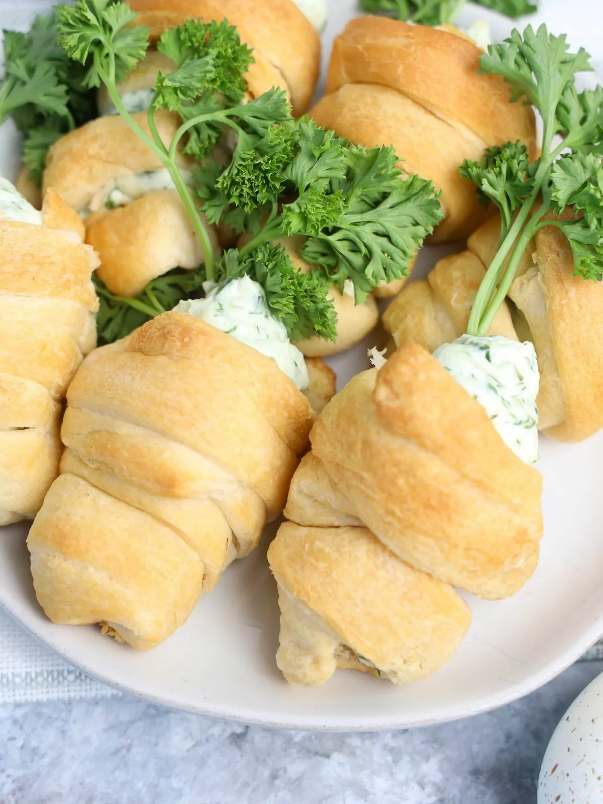 baked carrot shaped crescent rolls on plate.