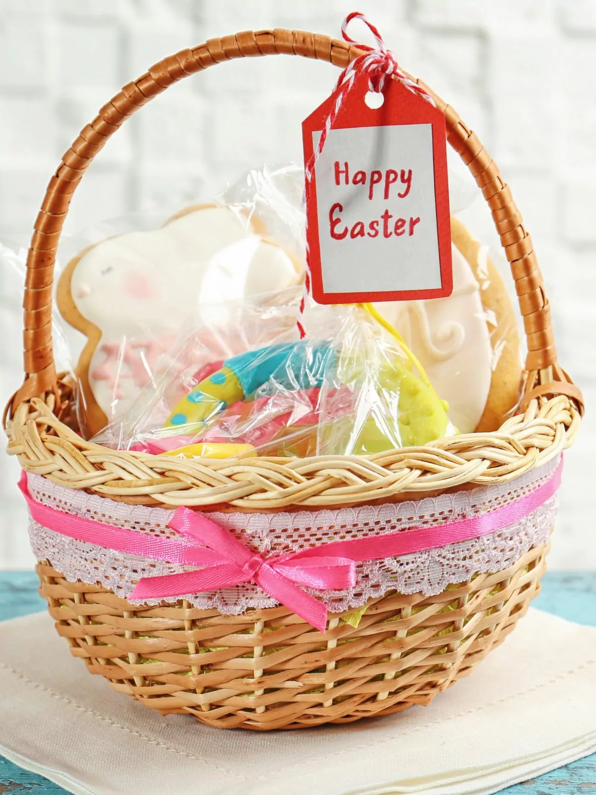 Wicker Easter basket filled with freshly baked, homemade cookies decorated for the holiday.