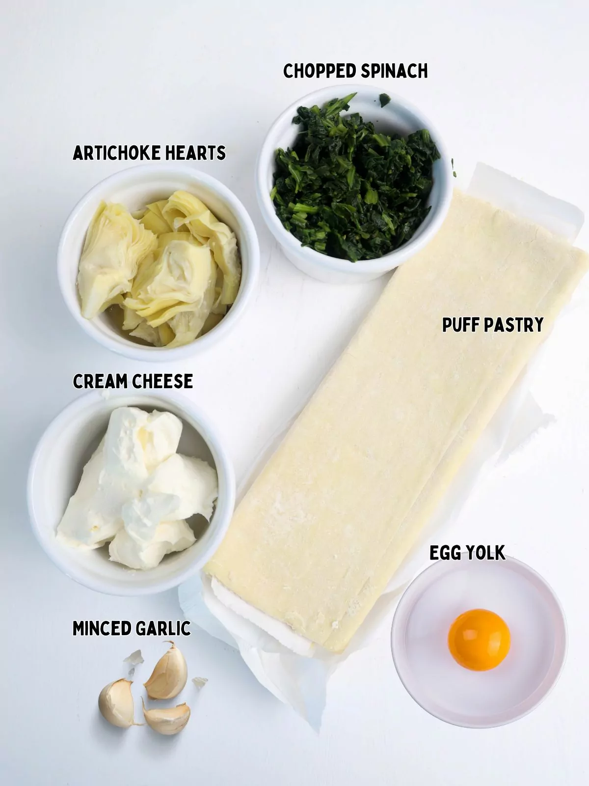 ingredients for spinach artichoke dip with puff pastry sheet.