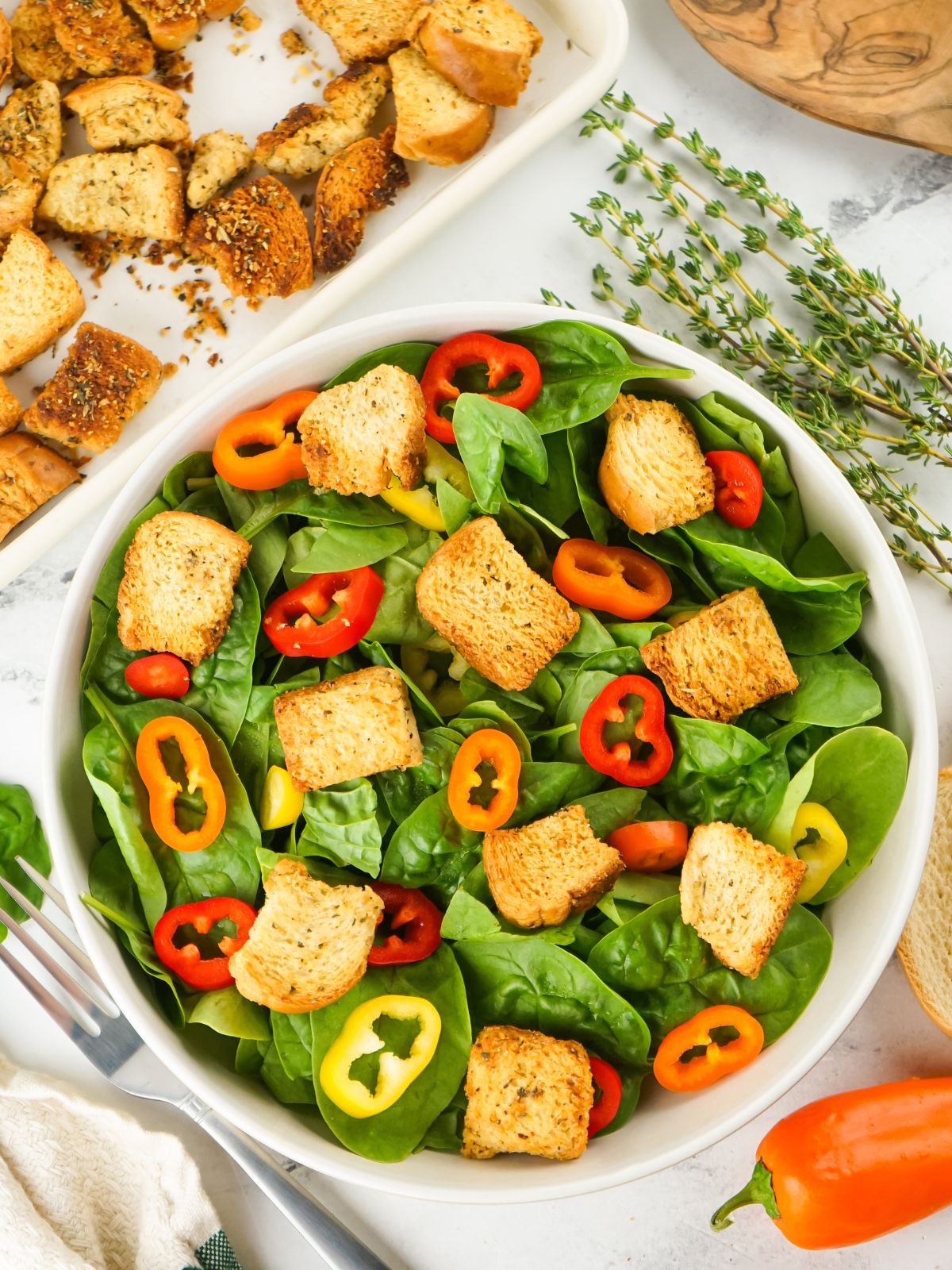 tossed salad in bowl with croutons.