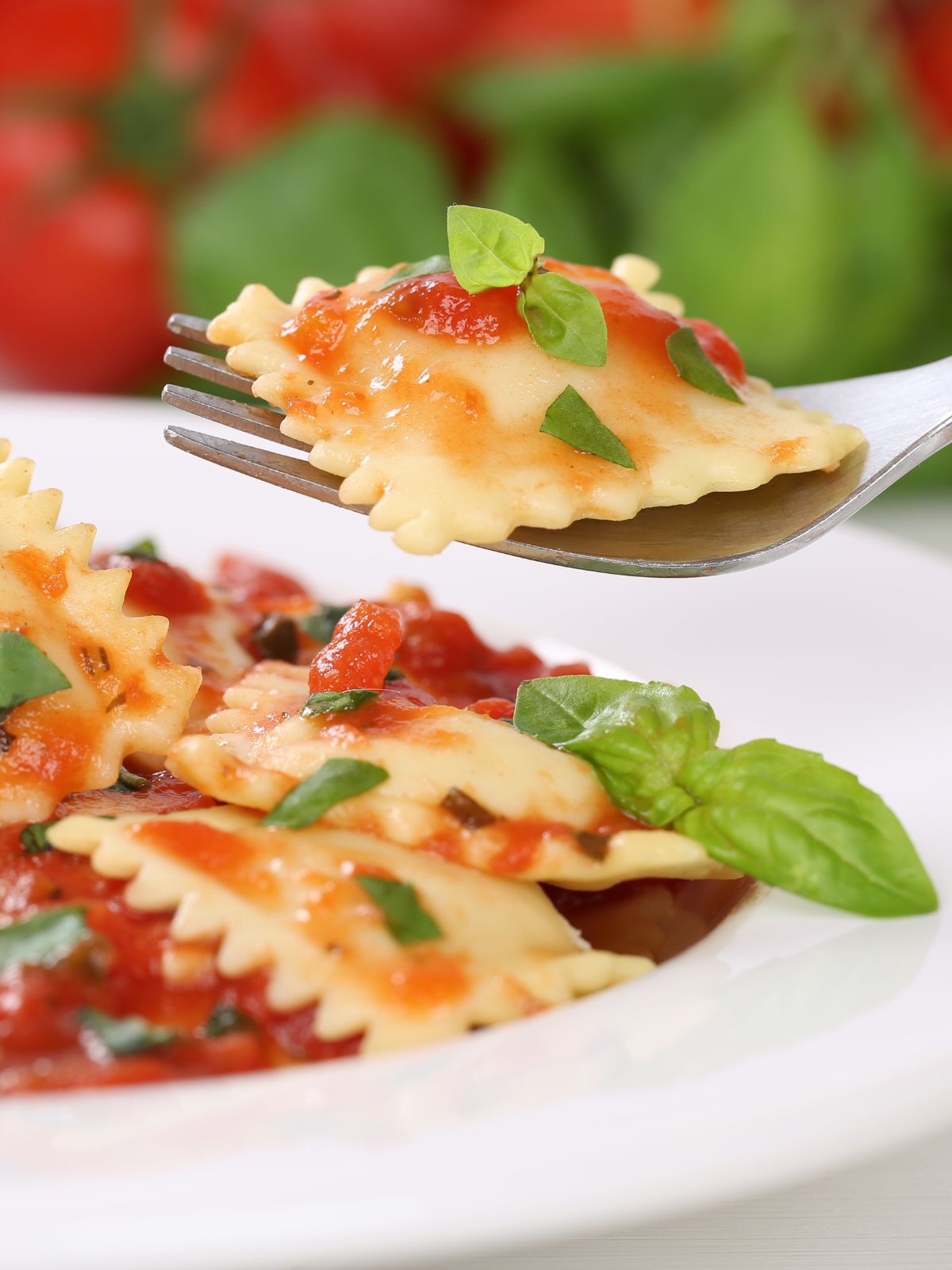 homemade ravioli with cheese on fork.