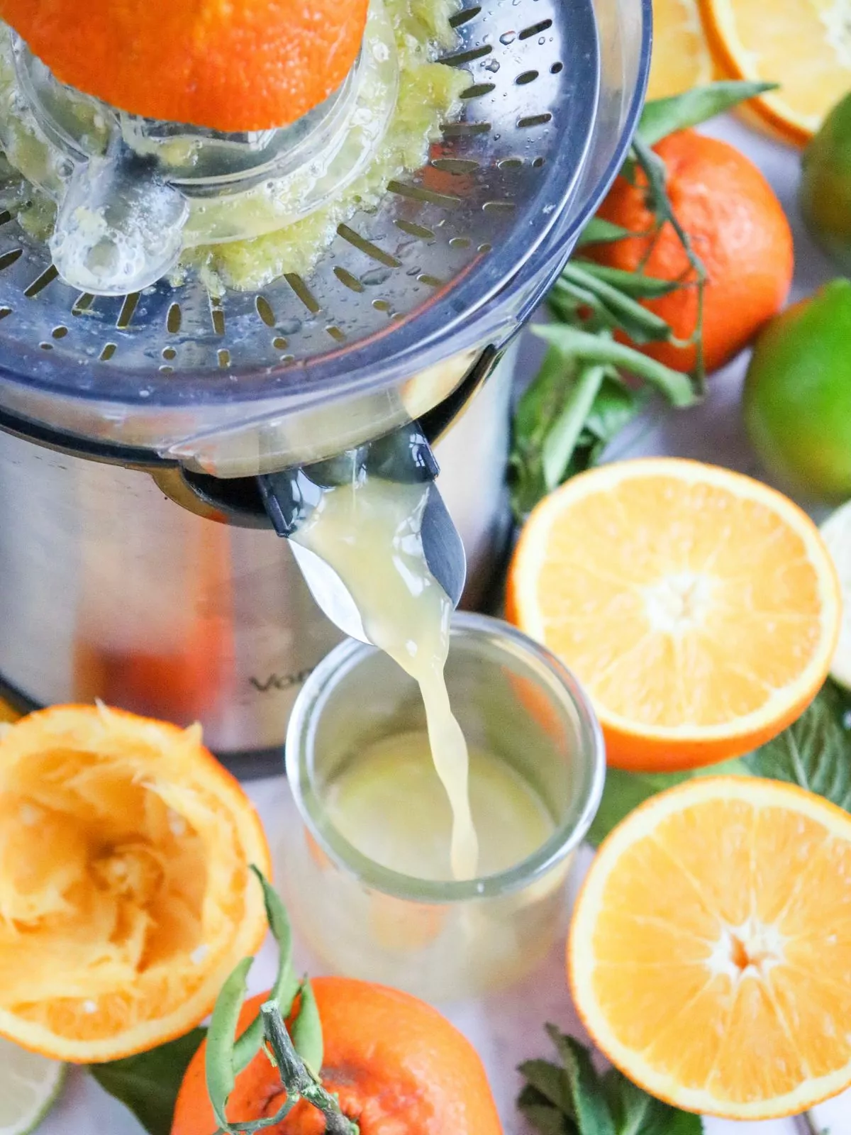 Using a juice machine to squeeze citrus.