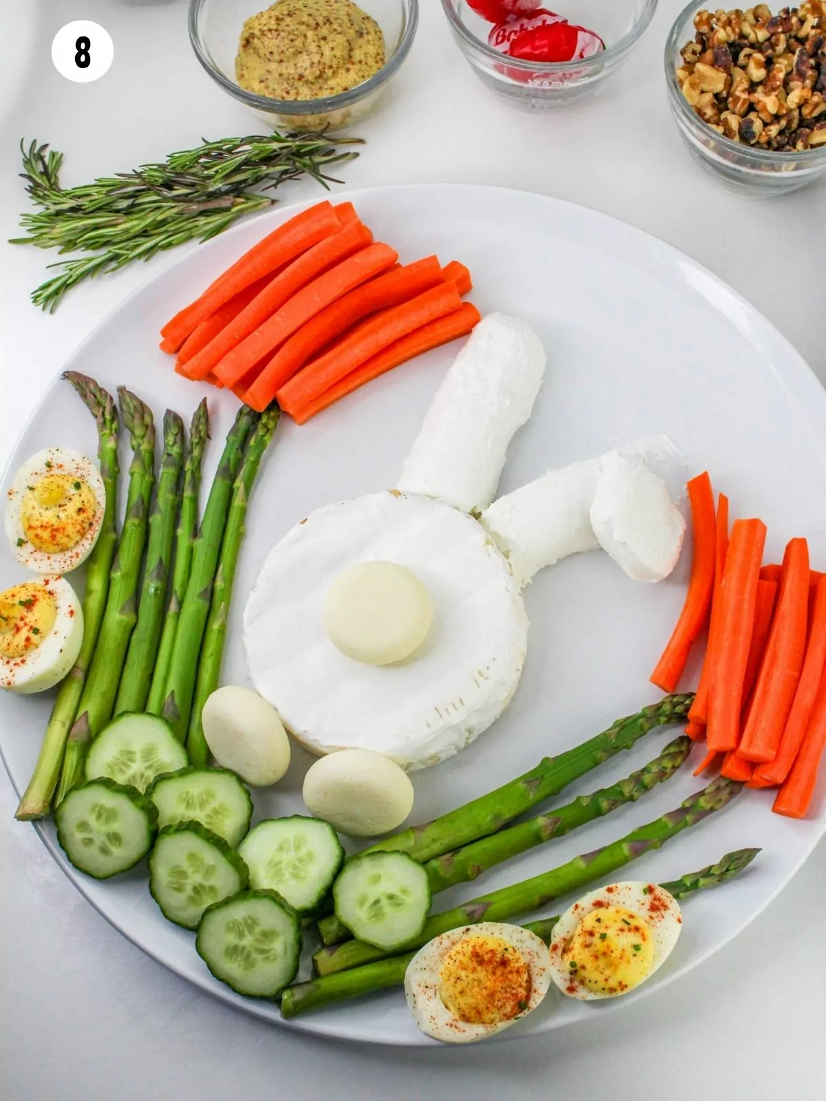 bunny cheese with veggies, deviled eggs on platter.