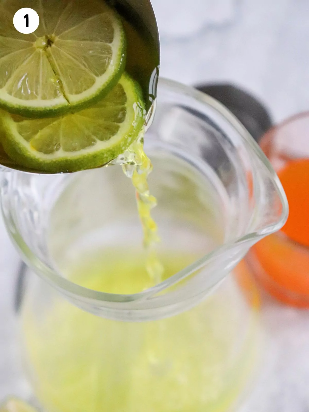 add lime juice to pitcher.