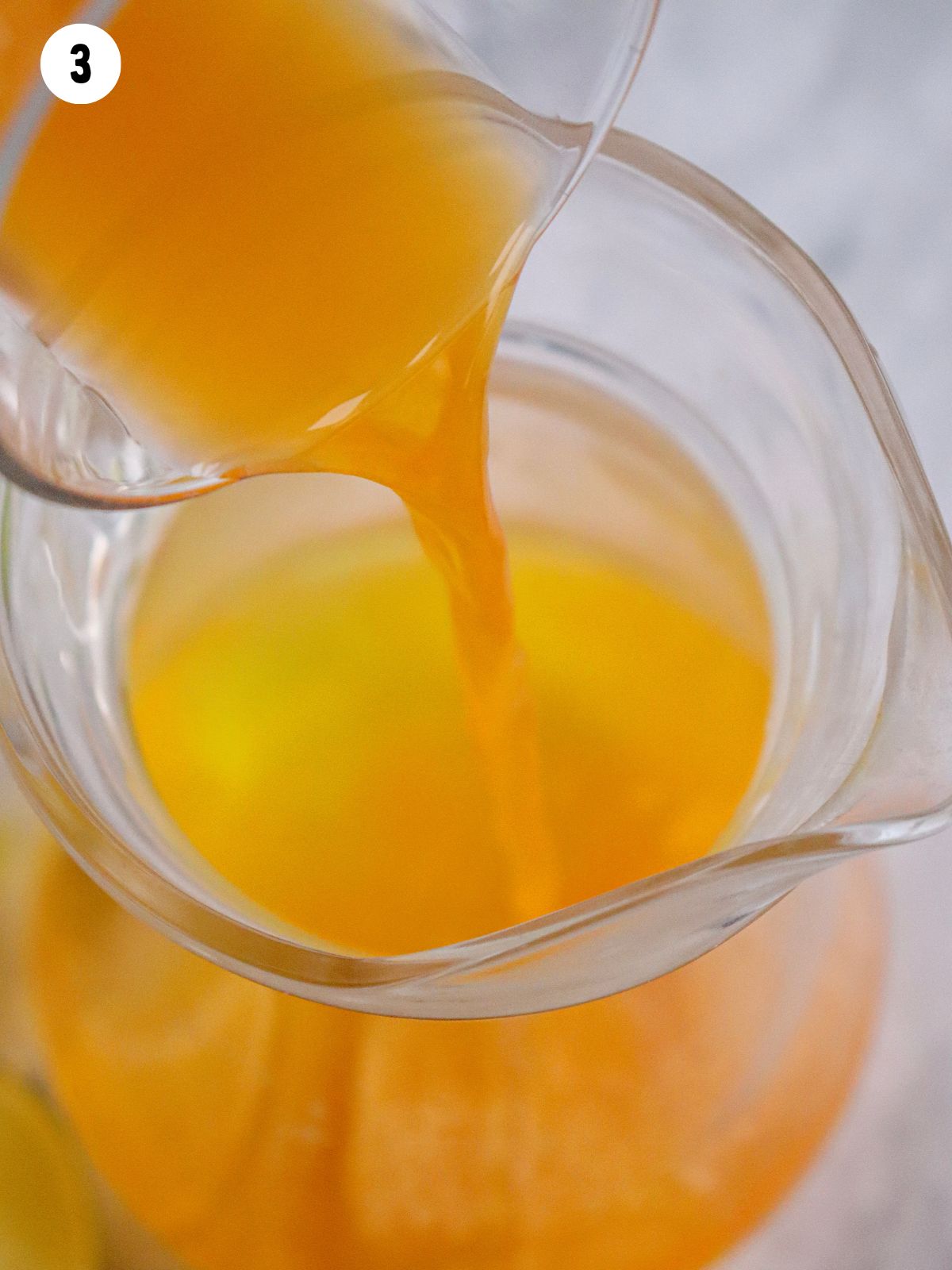 add orange juice to pitcher.
