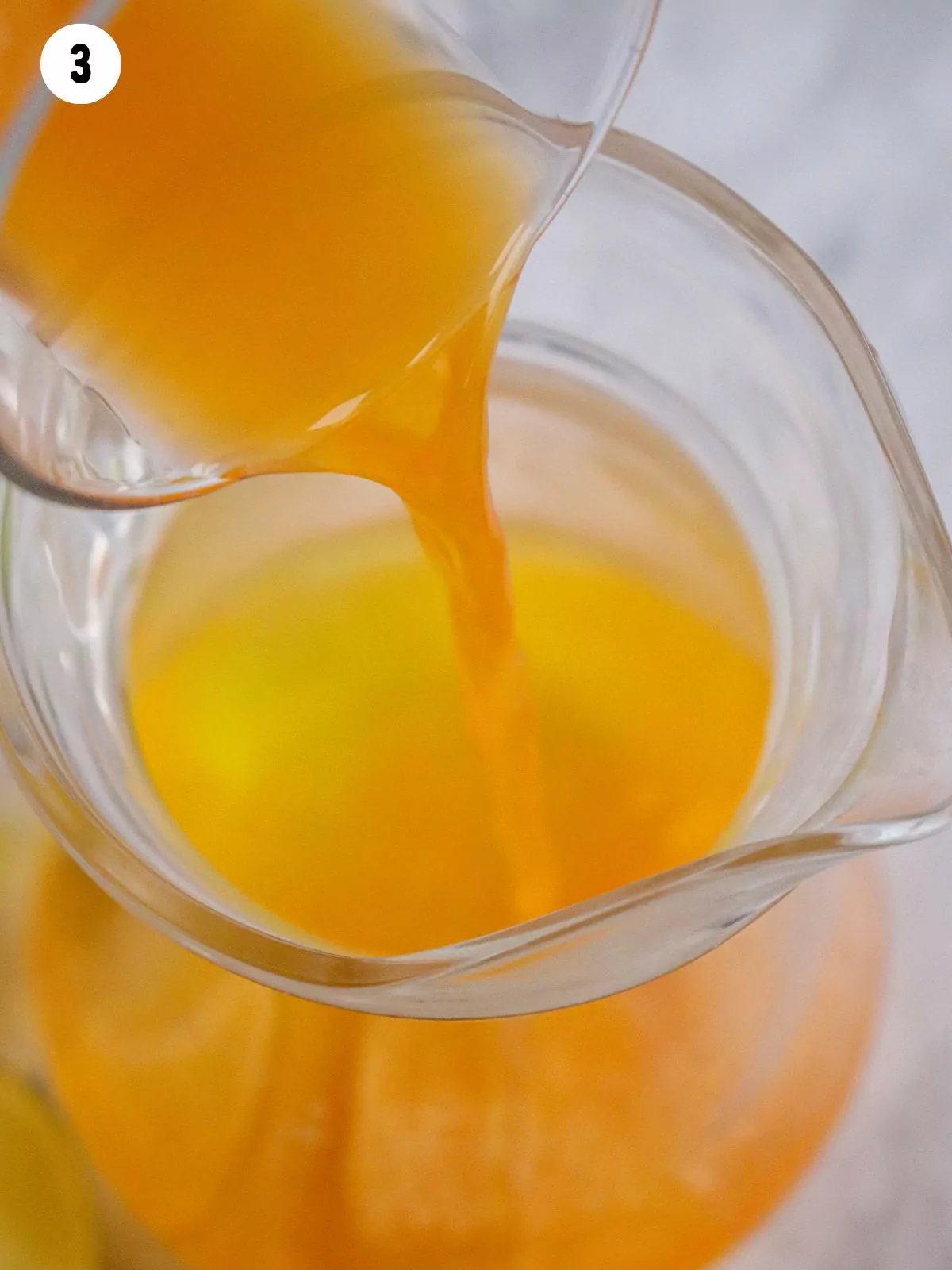add orange juice to pitcher.
