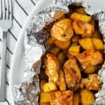 foil packet dinner of air fryer chicken and potatoes.