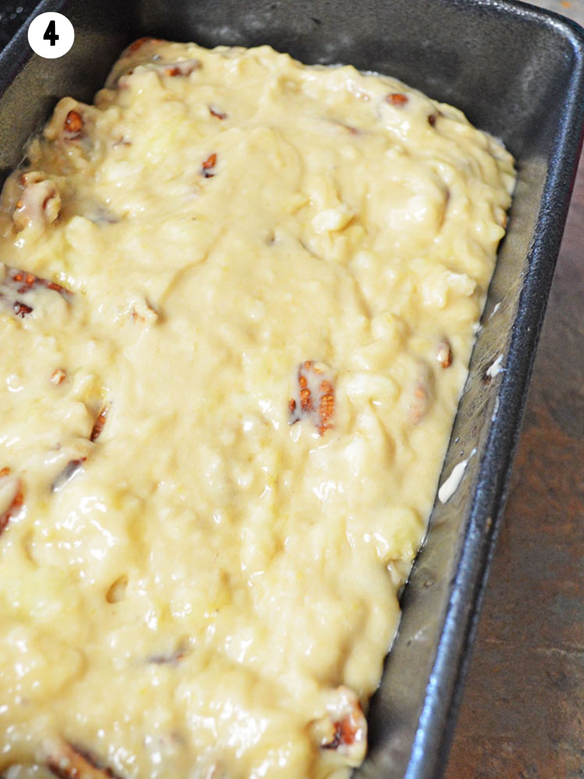 batter with nuts in loaf pan.