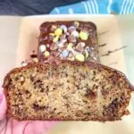 Slice of banana bread with colorful Easter candy surprises.