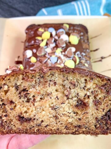 Slice of banana bread with colorful Easter candy surprises.