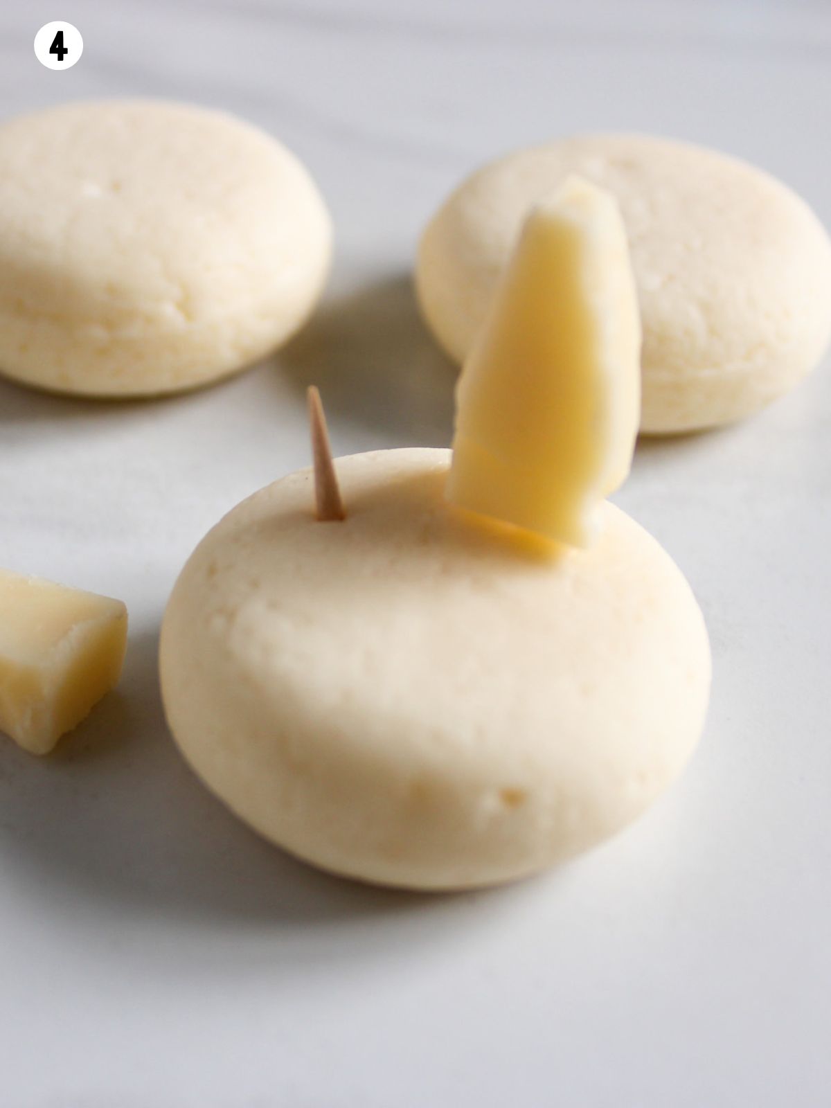 add bunny ear of cheese to round cheese ball.