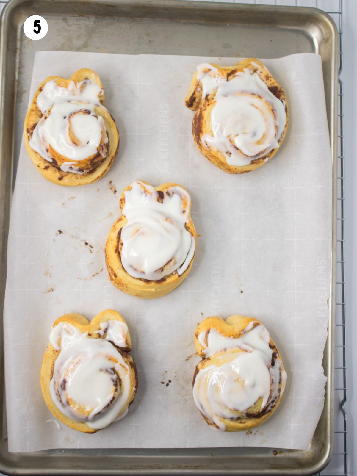baked and frosted Pillsbury cinnamon rolls shaped into bunnies for Easter.