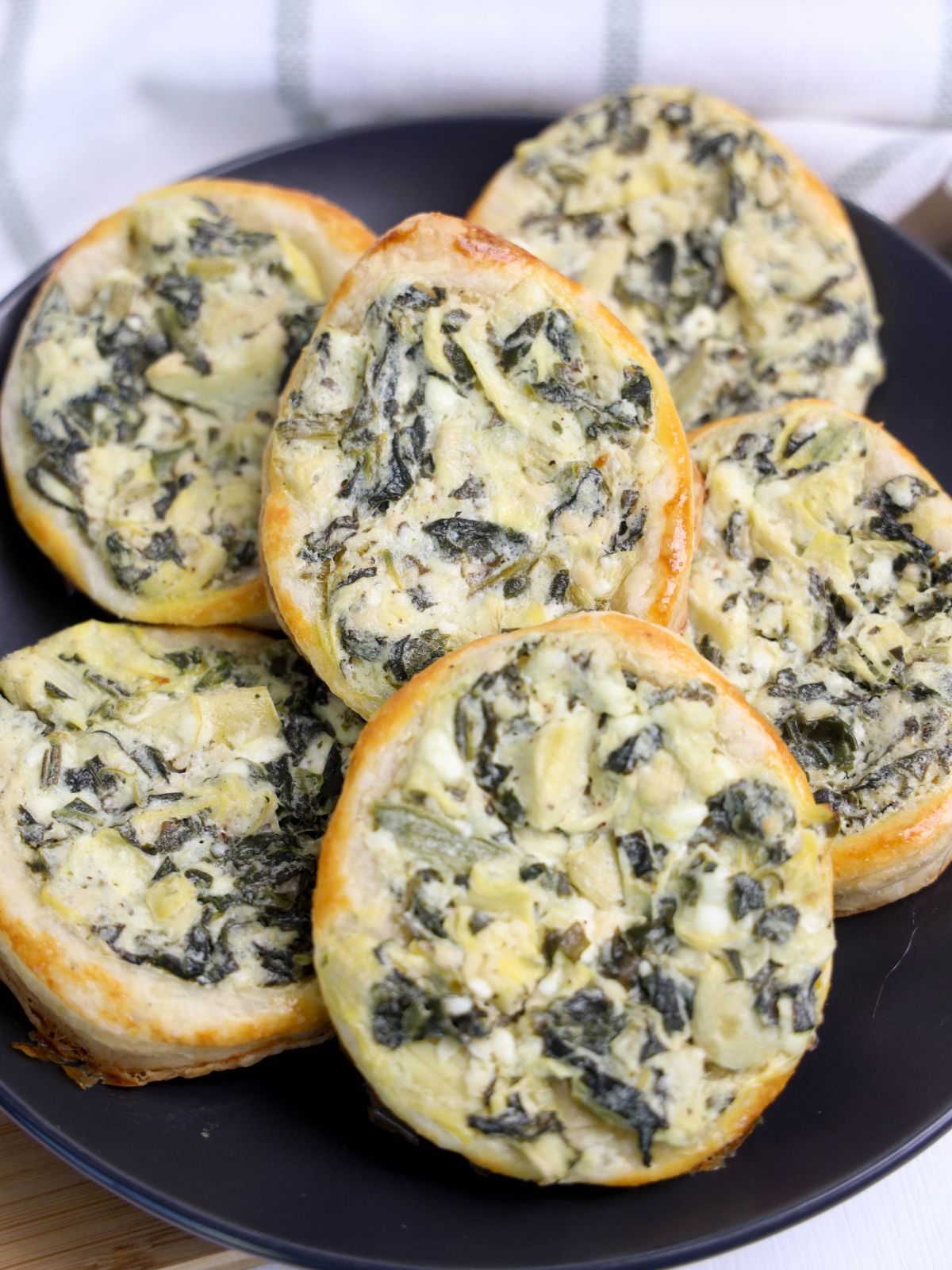 closeup of baked egg shaped puff pastry appetizer for Easter.