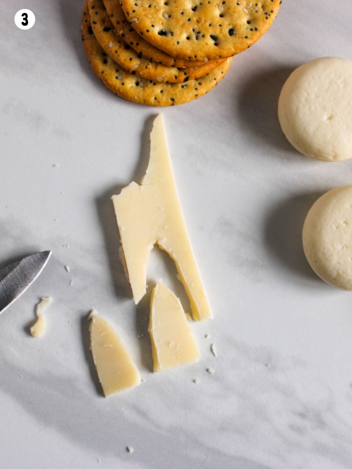 making bunny ears out of sliced cheese.