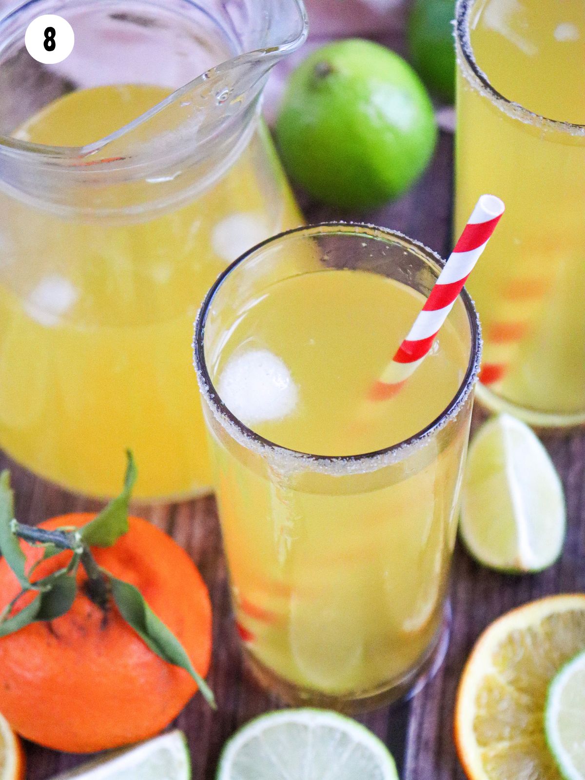 pitcher of lime water with glass.