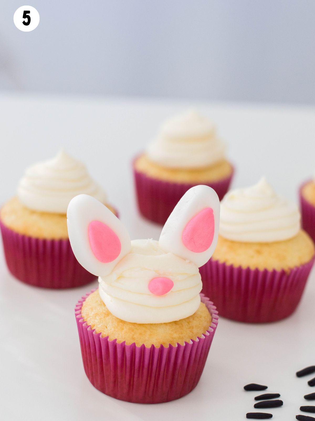 frosted cupcakes with bunny ears.